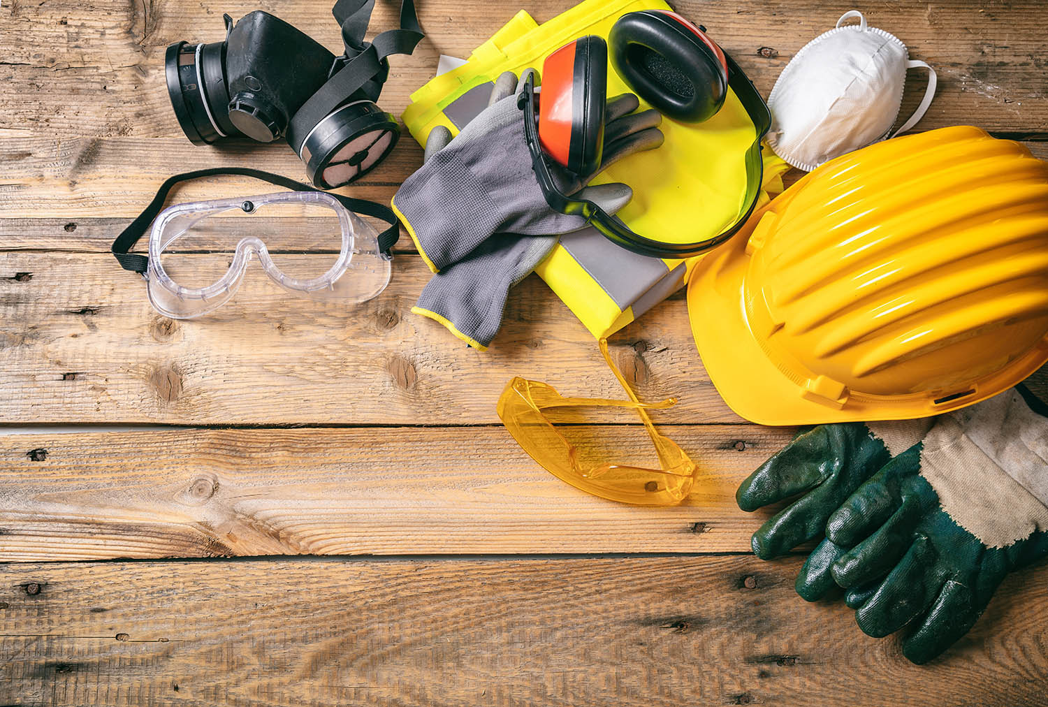 Construction safety. Protective hard hat, headphones, gloves and